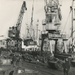 Photograph showing loading scrap metal at Blyth Harbour, Blyth, Northumberland.